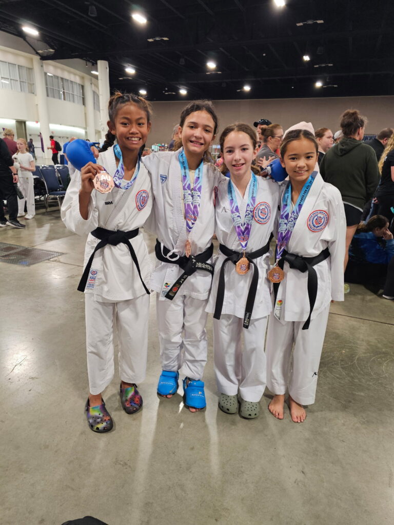 children receiving medals at competition