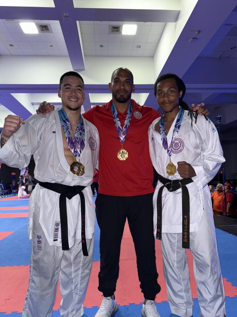 Certified traditional karate instructor and students at competition